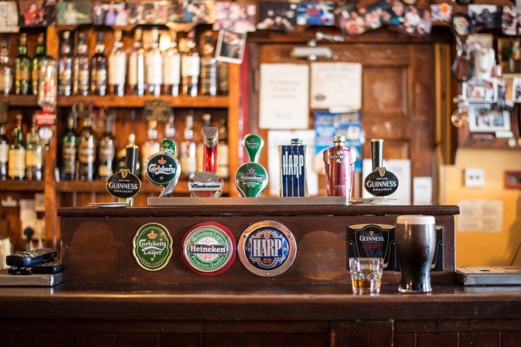 Beer taps standing on a pub's bar.