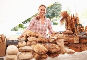 Female Bakery Stall Holder At Farmers Fresh Food Market